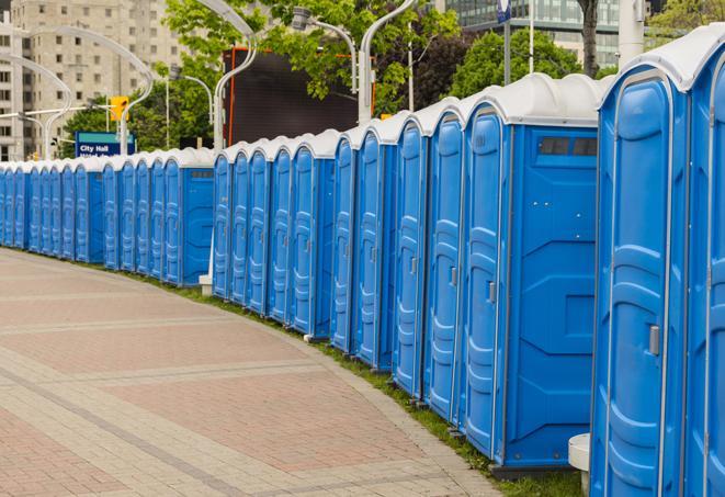 a row of portable restrooms at a fairground, offering visitors a clean and hassle-free experience in altus